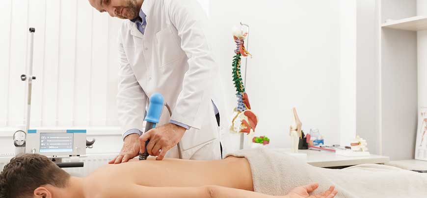 Patient receiving Shockwave Therapy to relieve pain