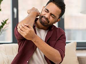 Man suffering with elbow pain