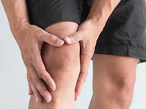 Man suffering with from knee pain